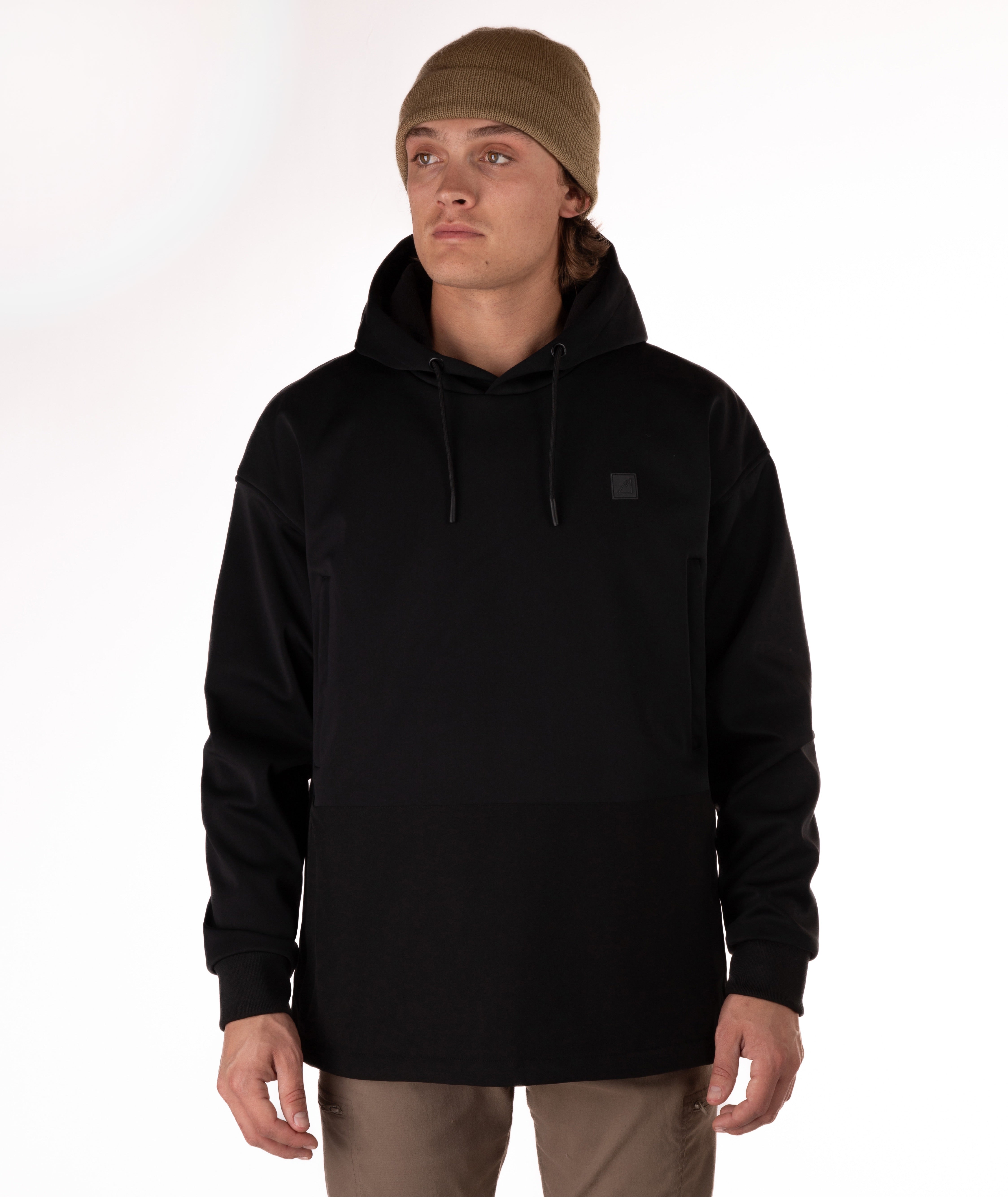 Person wearing a black softshell hoodie on a white background