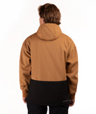 A person shown from the back wearing a hooded jacket with a two-tone design: the upper portion is camel brown and the lower portion is black. The photo is taken against a clean white studio background.