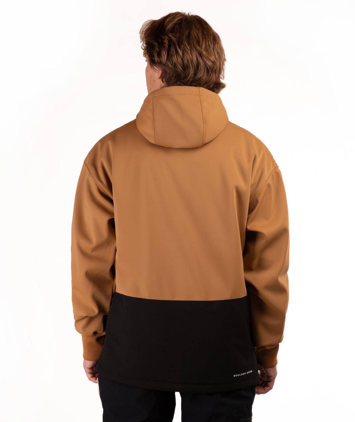 A person shown from the back wearing a hooded jacket with a two-tone design: the upper portion is camel brown and the lower portion is black. The photo is taken against a clean white studio background.