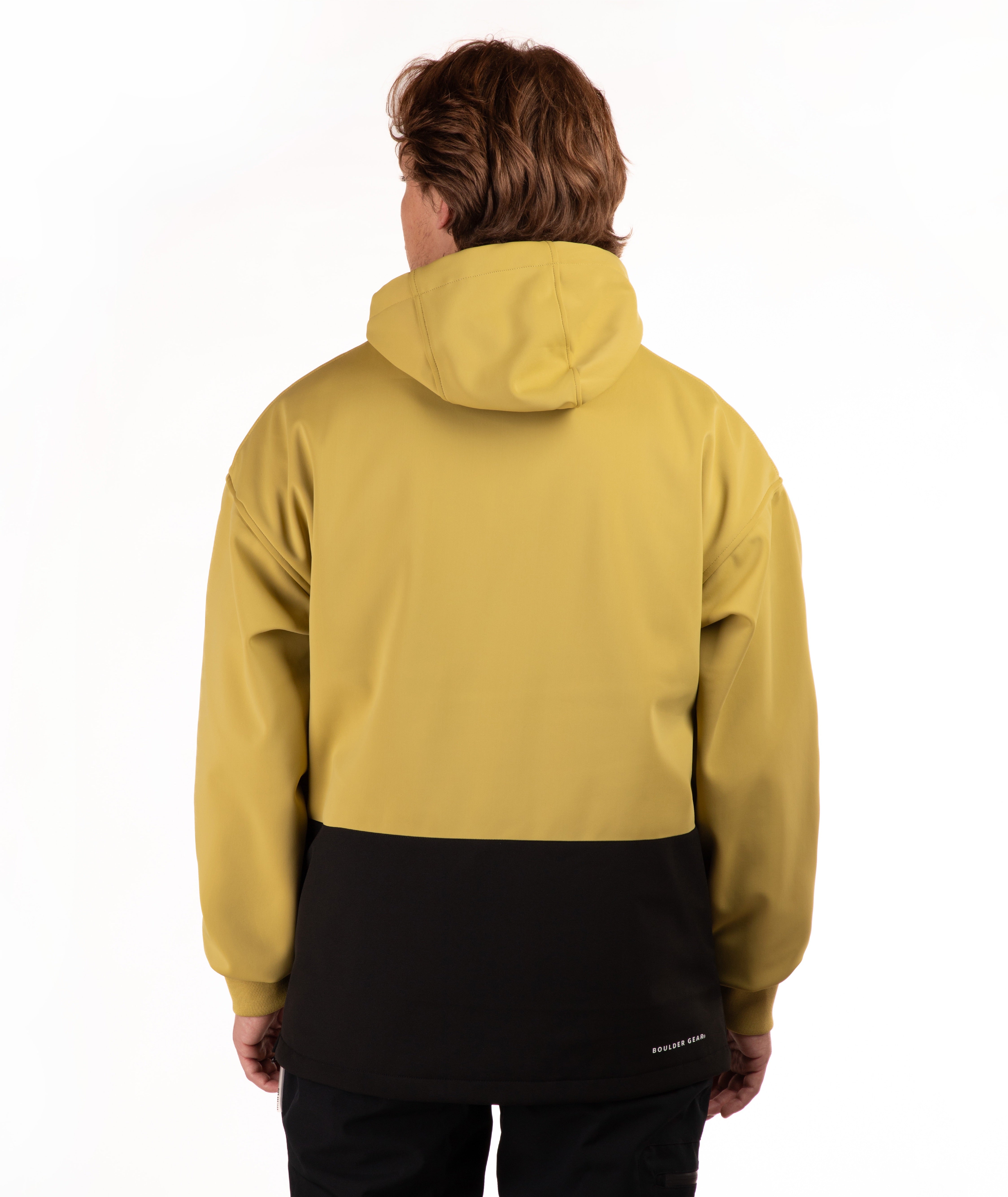 A person shown from the back wearing a hooded jacket with a two-tone design, featuring a mustard yellow upper section and a black lower section, against a plain white background.