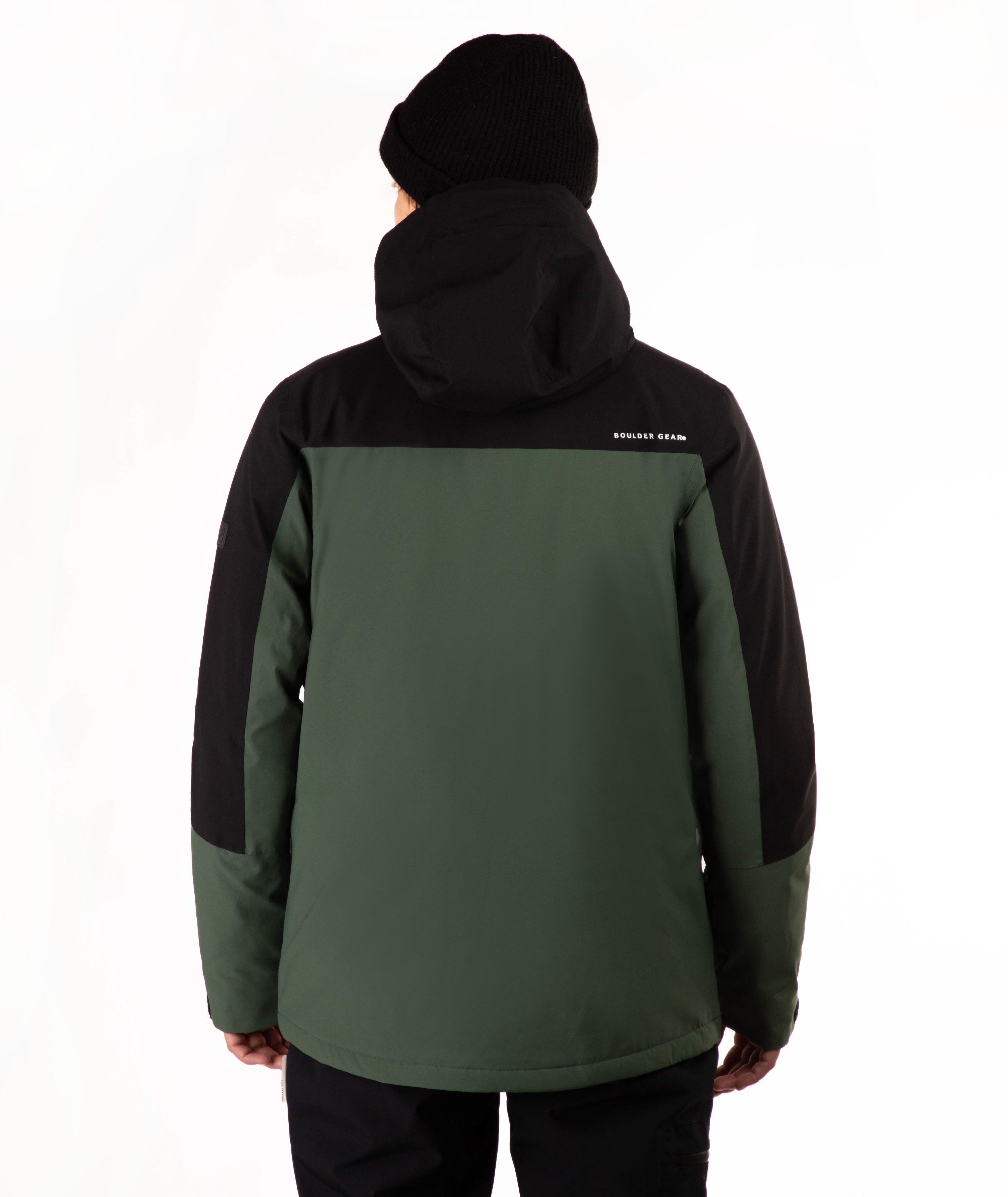 A person shown from the back wearing a color-blocked hooded jacket in dark green and black, along with a black beanie, against a plain white studio background.