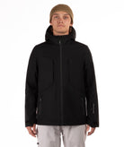 Person wearing a black jacket with black accents on a white background