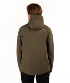 A man viewed from the back wearing an olive green hooded jacket and black pants against a plain white background.