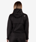 back of a Person wearing a black jacket with a logo on the back against a white background