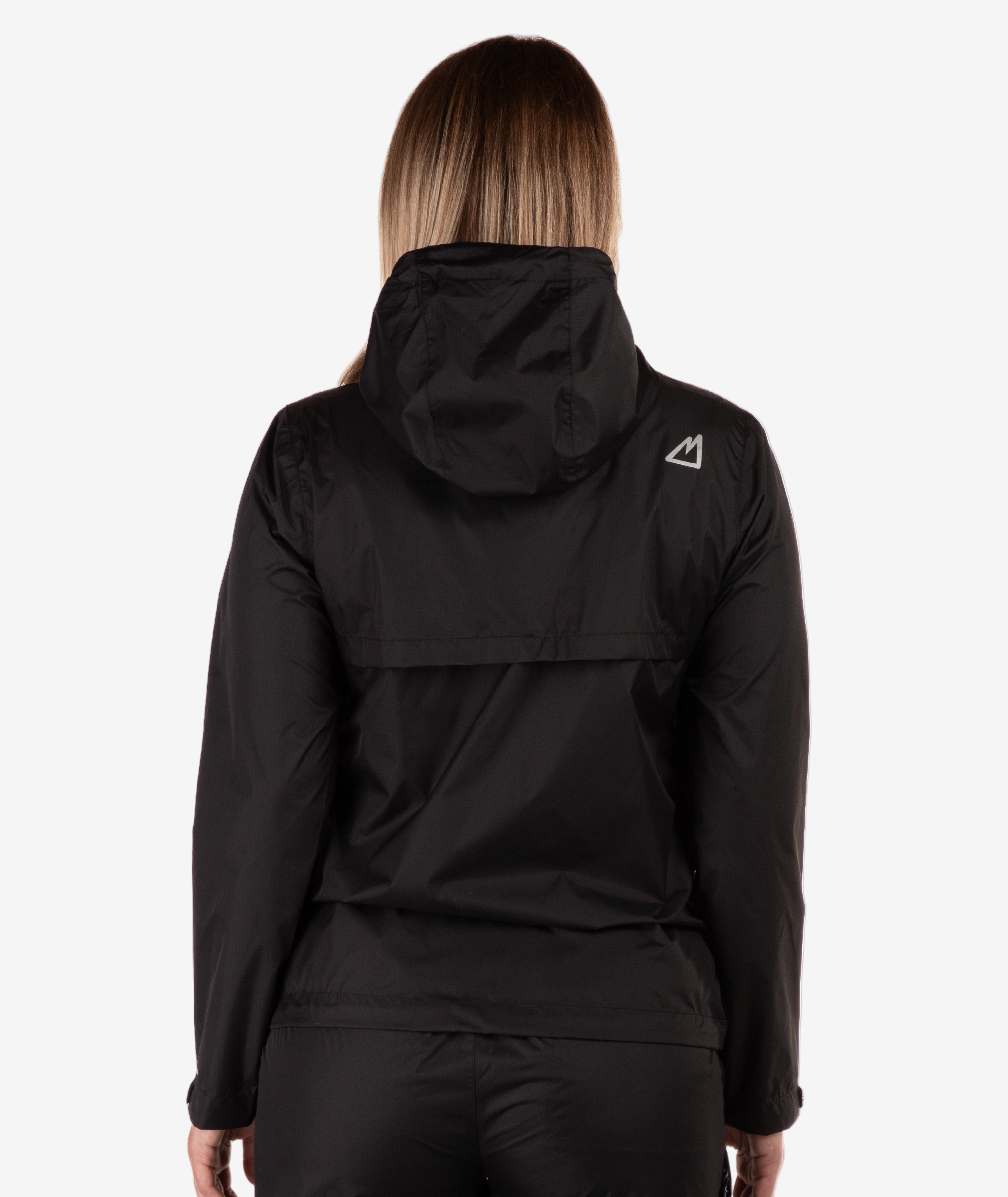 back of a Person wearing a black jacket with a logo on the back against a white background