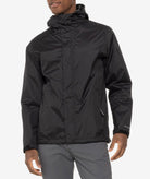 Person wearing a black rain jacket on a white background