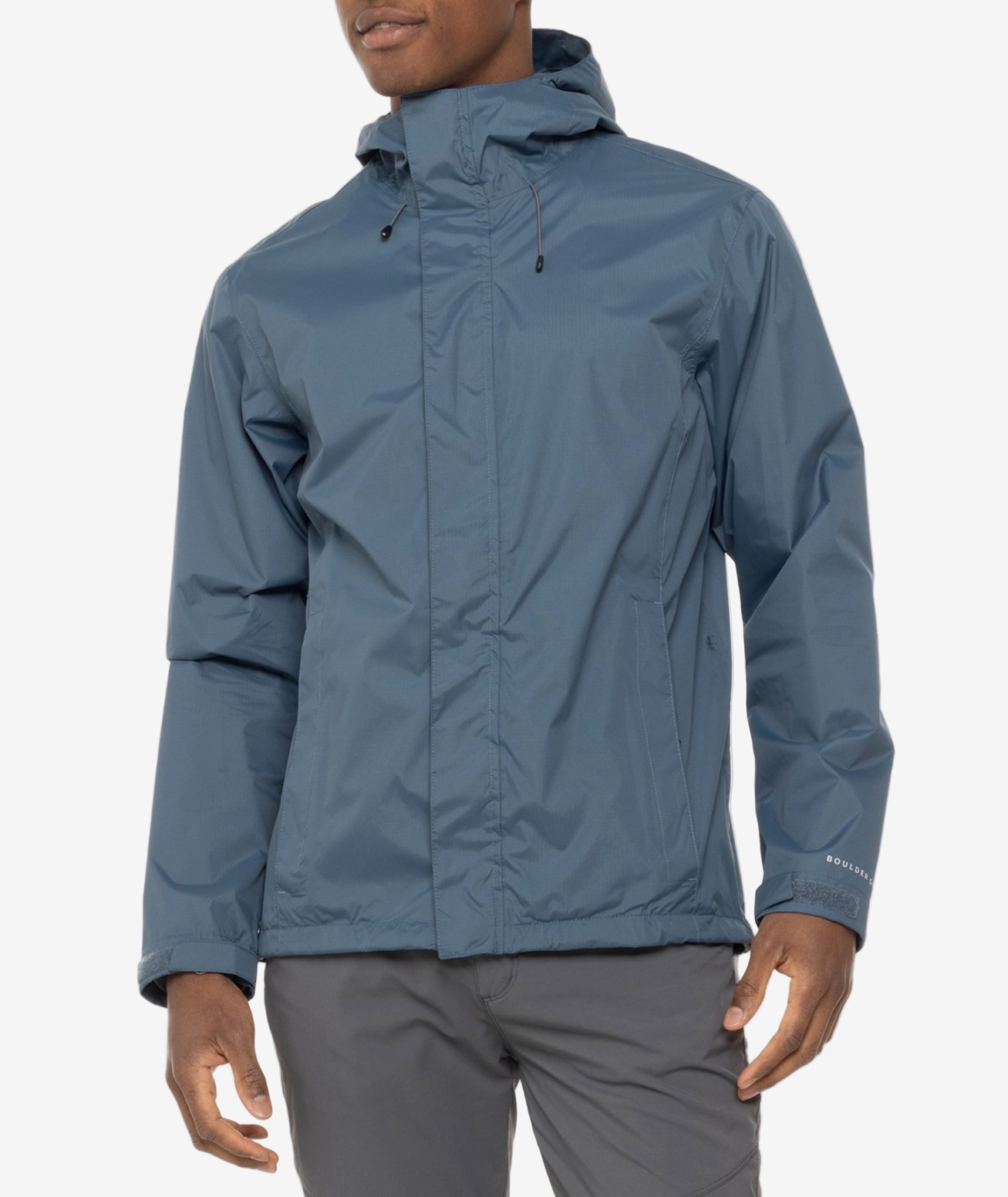 Person wearing a blue rain jacket on a white background