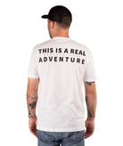 back of a Man wearing a white t-shirt with text and a black cap on a white background