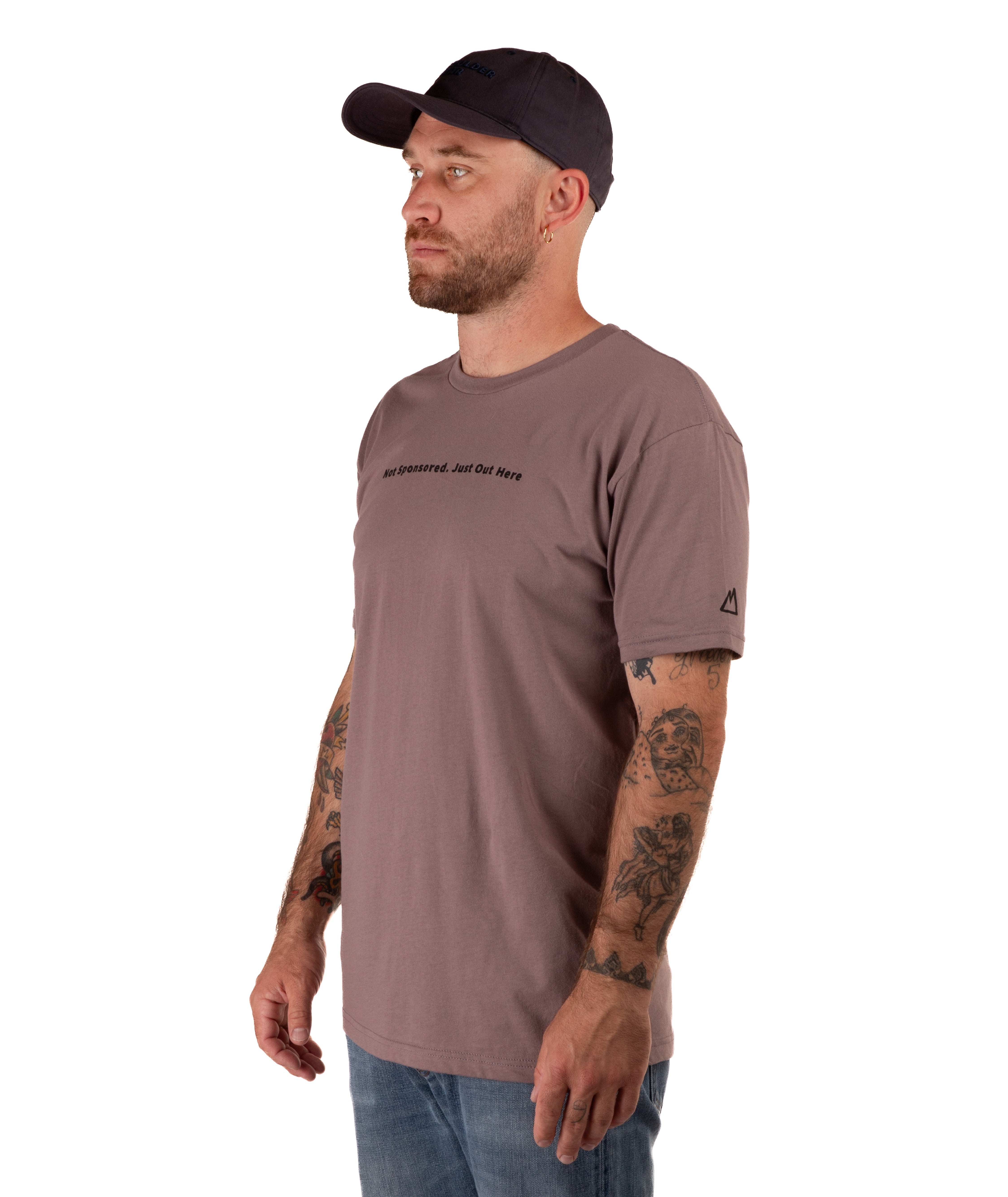 man in a brown shirt with black text and a black hat on a white background
