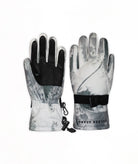 A pair of winter gloves with a gray and white camouflage pattern, featuring black palms and a black adjustable wrist strap with a buckle.