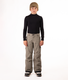 youth boy wearing a black long-sleeve shirt and beige snow pants on a white background