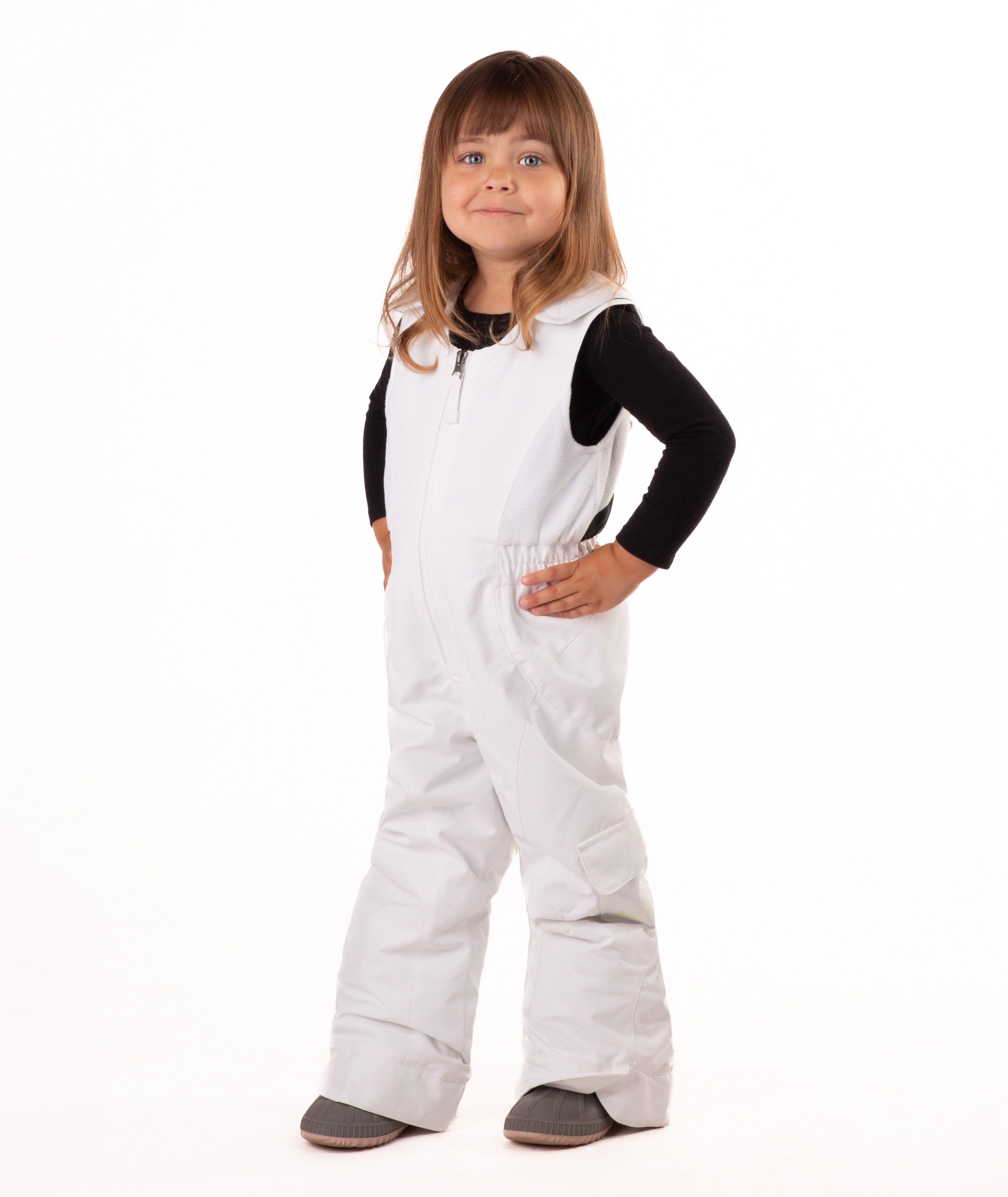 child wearing a white snow bib with black top on a white background
