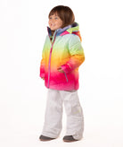 Child wearing a colorful gradient jacket and white pants on a white background