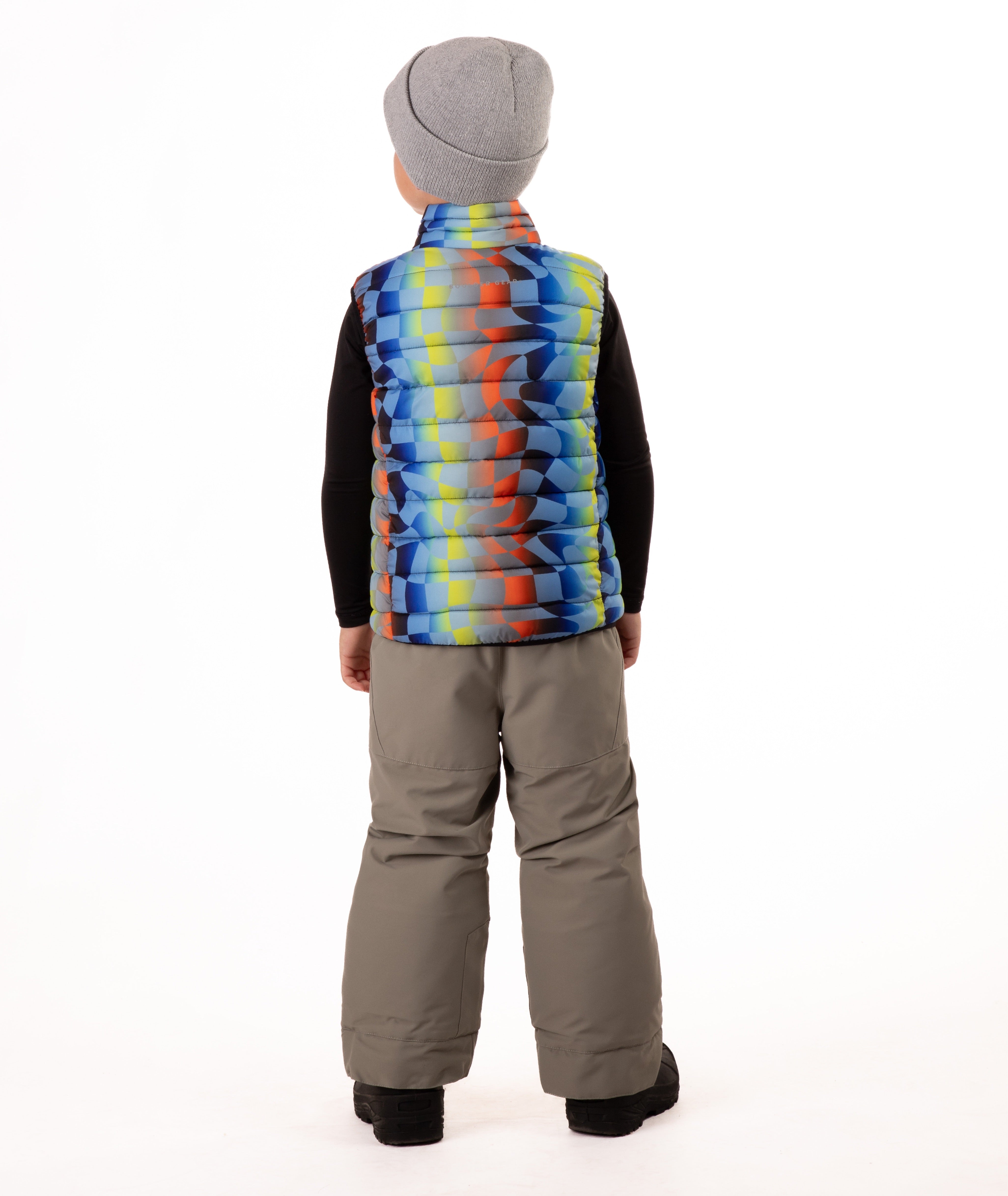 back of Child wearing a colorful checker patterned puffer vest on a white background