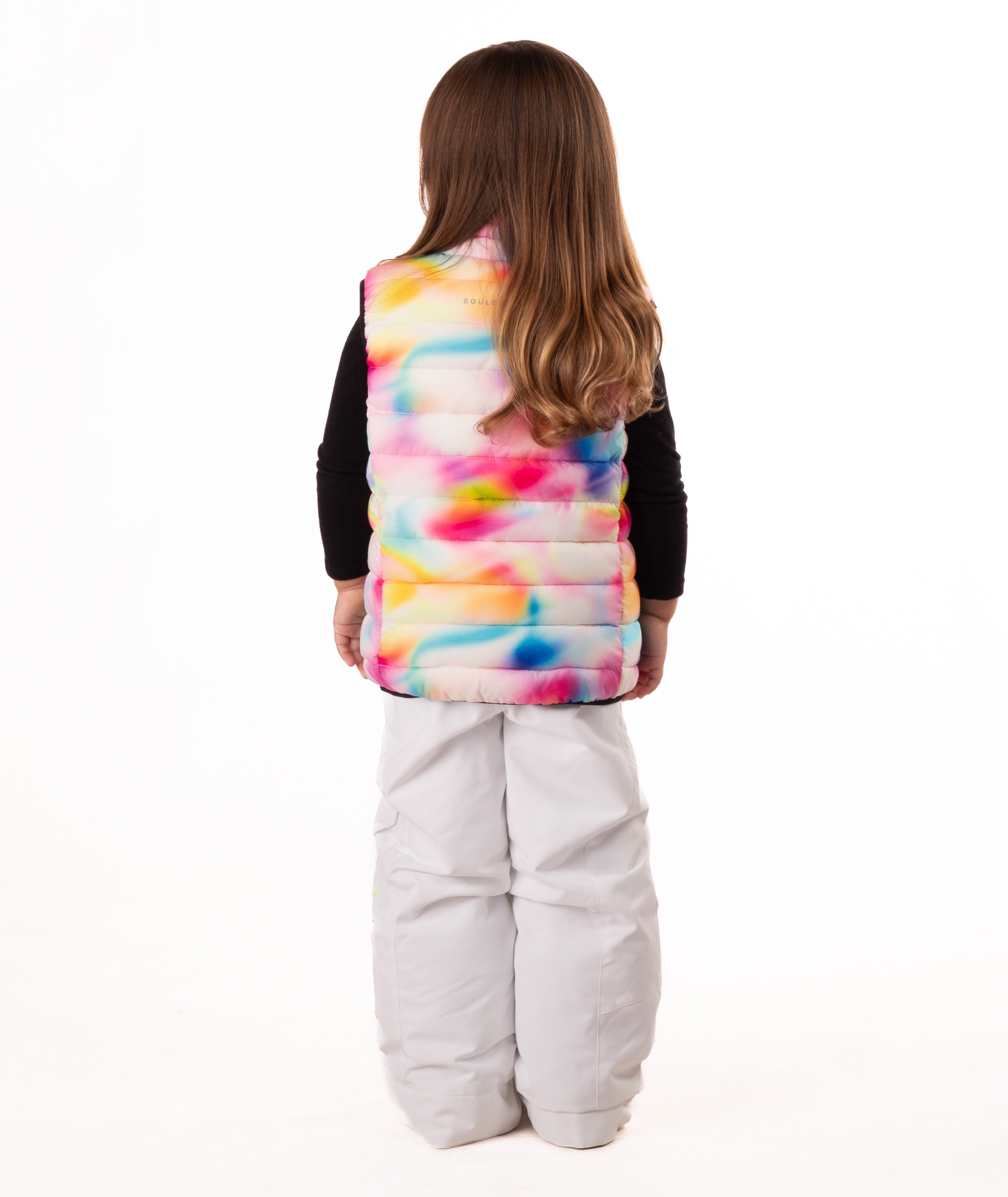 back of Child wearing multi colored abstract print vest with black accents on a white background