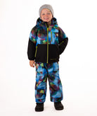 Child wearing a two-tone jacket with black  on the bottom half and multi tone blue printed top half on a white background