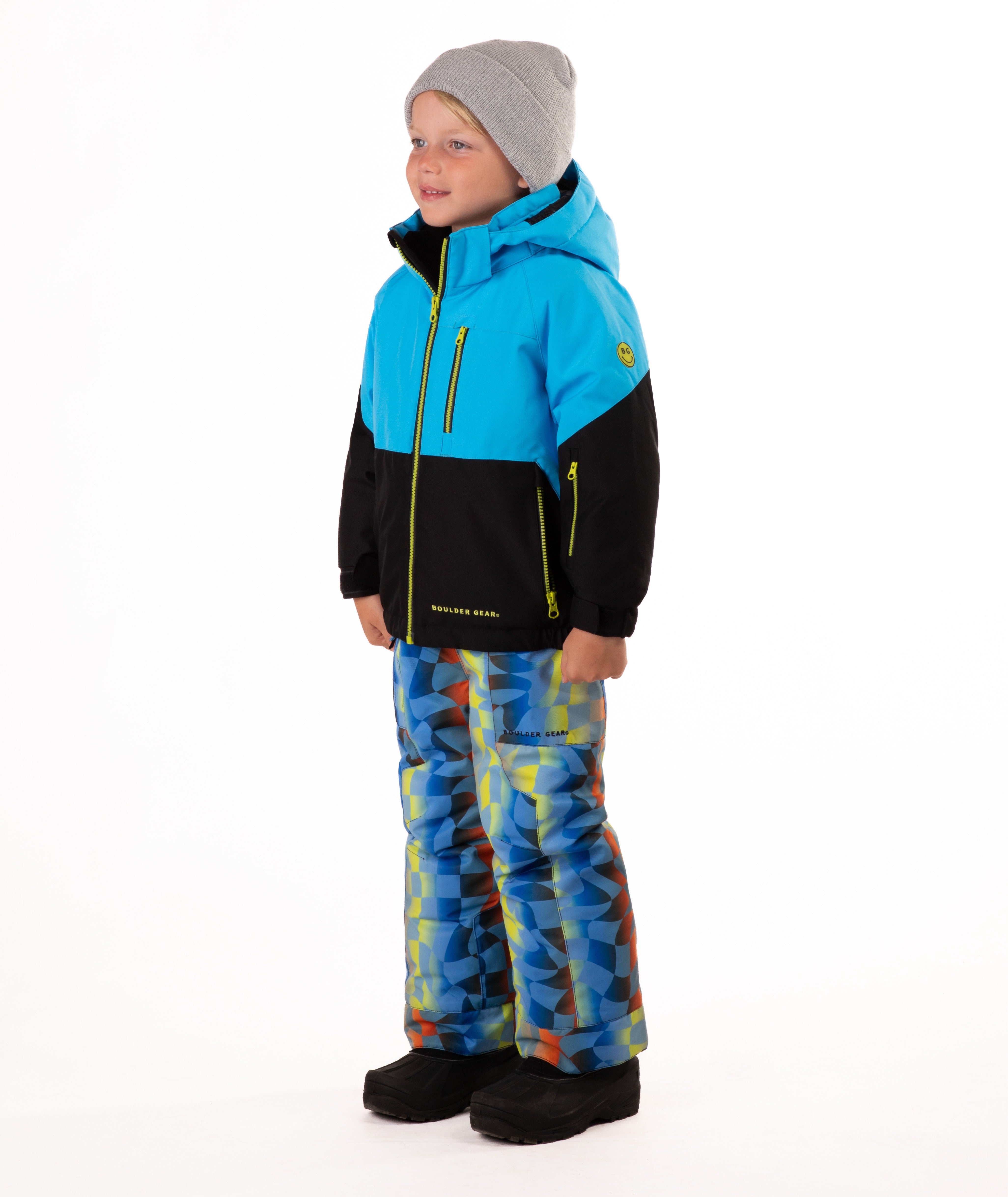 Child wearing a two-tone jacket with blue on the top and black on the bottom of the jacket