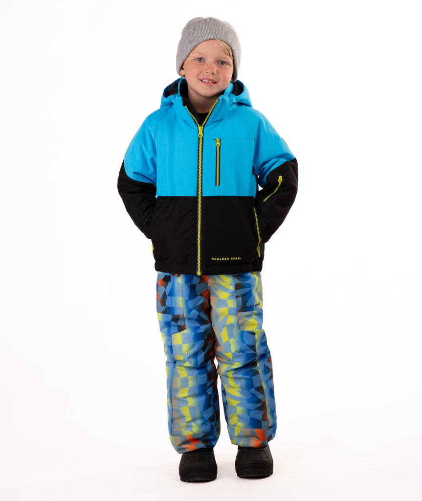 Child wearing a two-tone jacket with blue on the top and black on the bottom of the jacket on white background