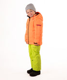 Child wearing a orange quilted winter jacket with chest pockets and hand-warmer pockets on a white background