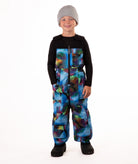 Child wearing colorful geometric print snow bibs on a white background