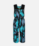 a pair of kids sized multi tone blue abstract patterned snow bibs on a white background