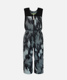 a pair of kids sized gray and black abstract patterned snow bibs on a white background