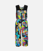 a pair of kids sized multi colored geometric patterned snow bibs on a white background