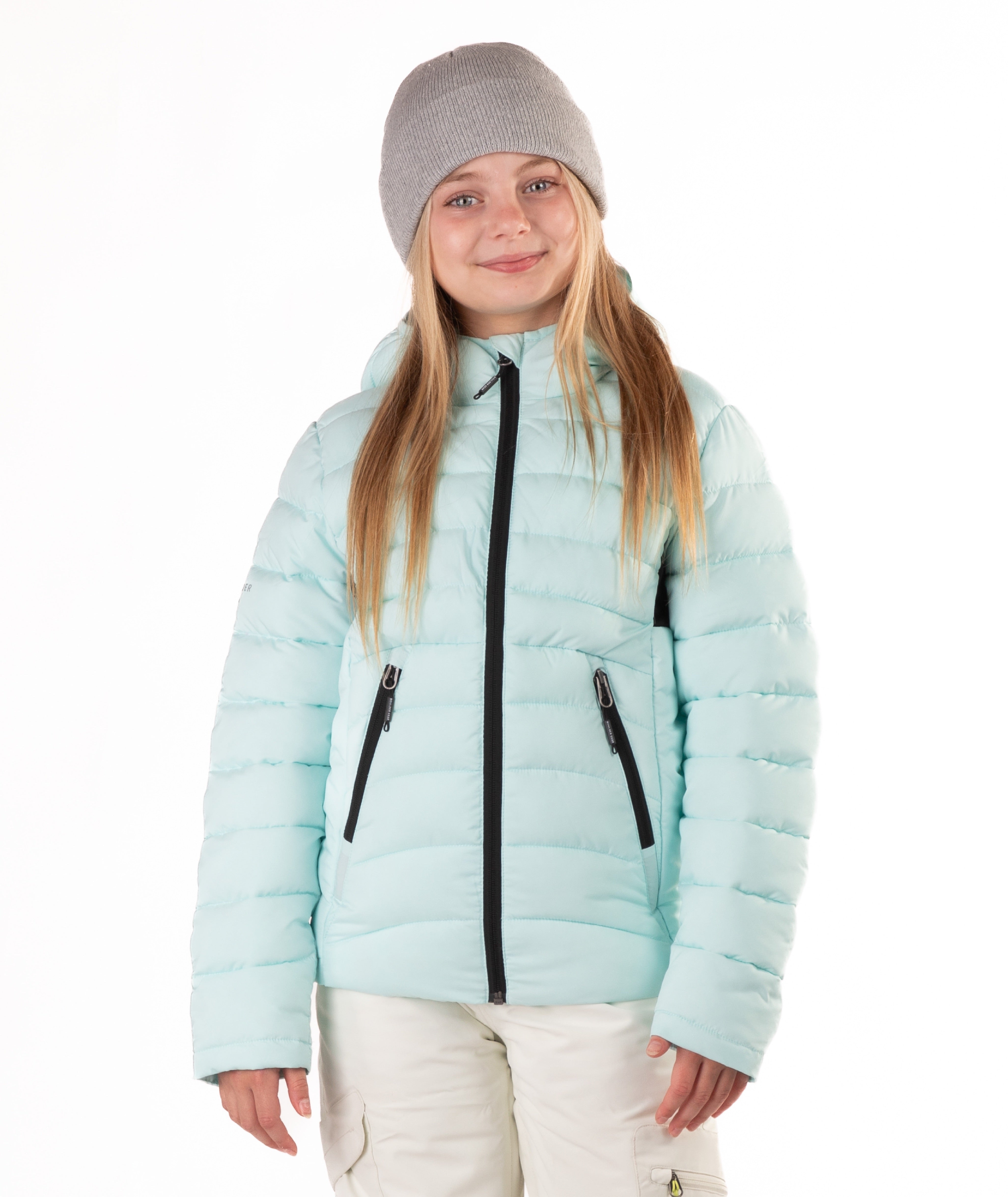 girl wearing a light blue puffer jacket on a white background