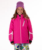 Youth girl wearing a bright pink ski jacket with white accents on a white background