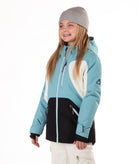 Youth Girl wearing a blue, white and black jacket with a white background