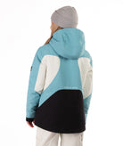 Youth Girl wearing a blue, white and black jacket with a white background