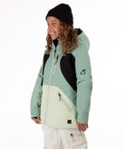 Youth Girl wearing a green and black jacket with a white background