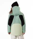 Youth Girl wearing a green and black jacket with a white background