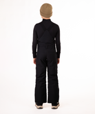 back of boy wearing black bibs and black top on a white background