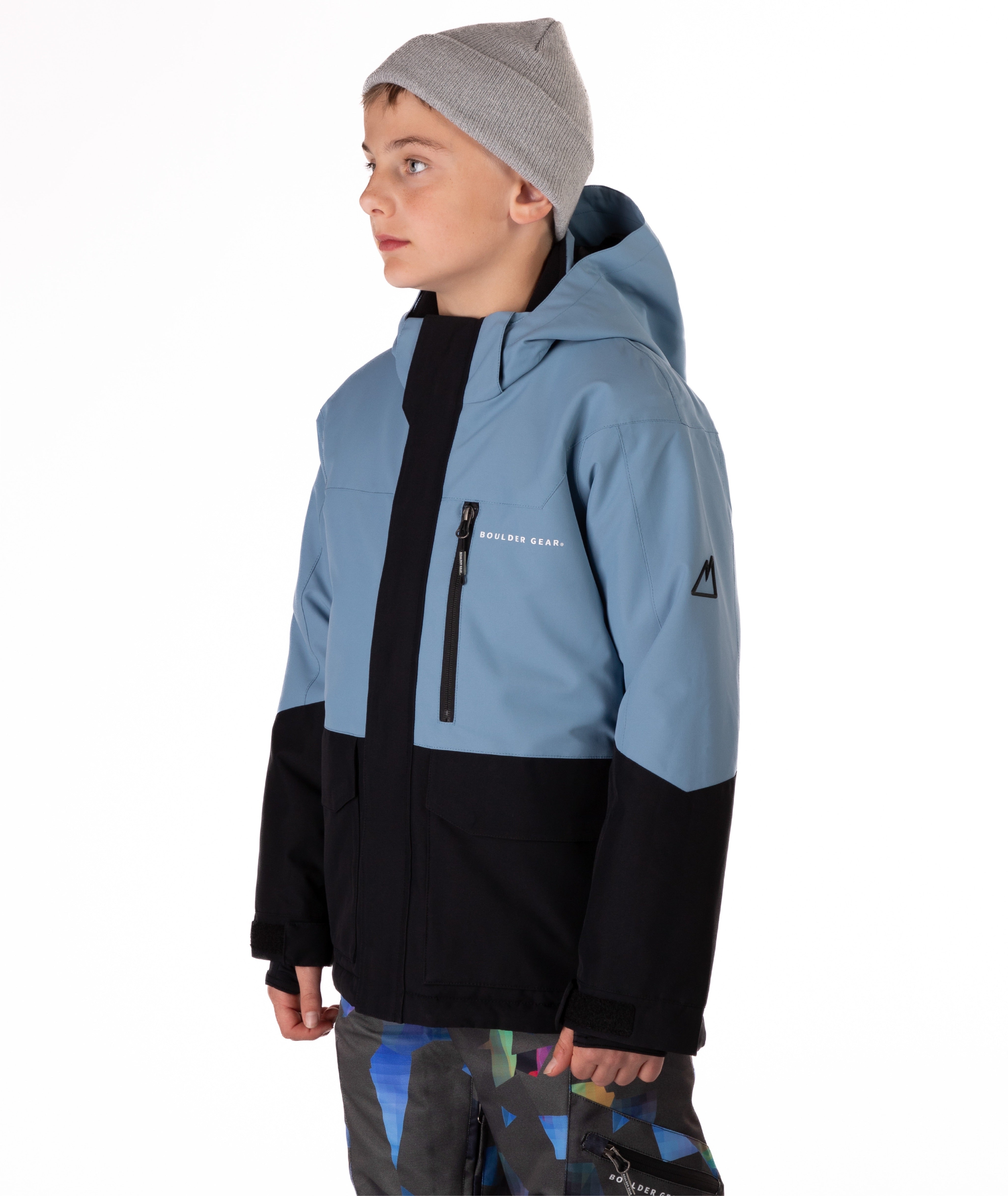Youth Boy wearing a blue and black jacket with a hood on a white background