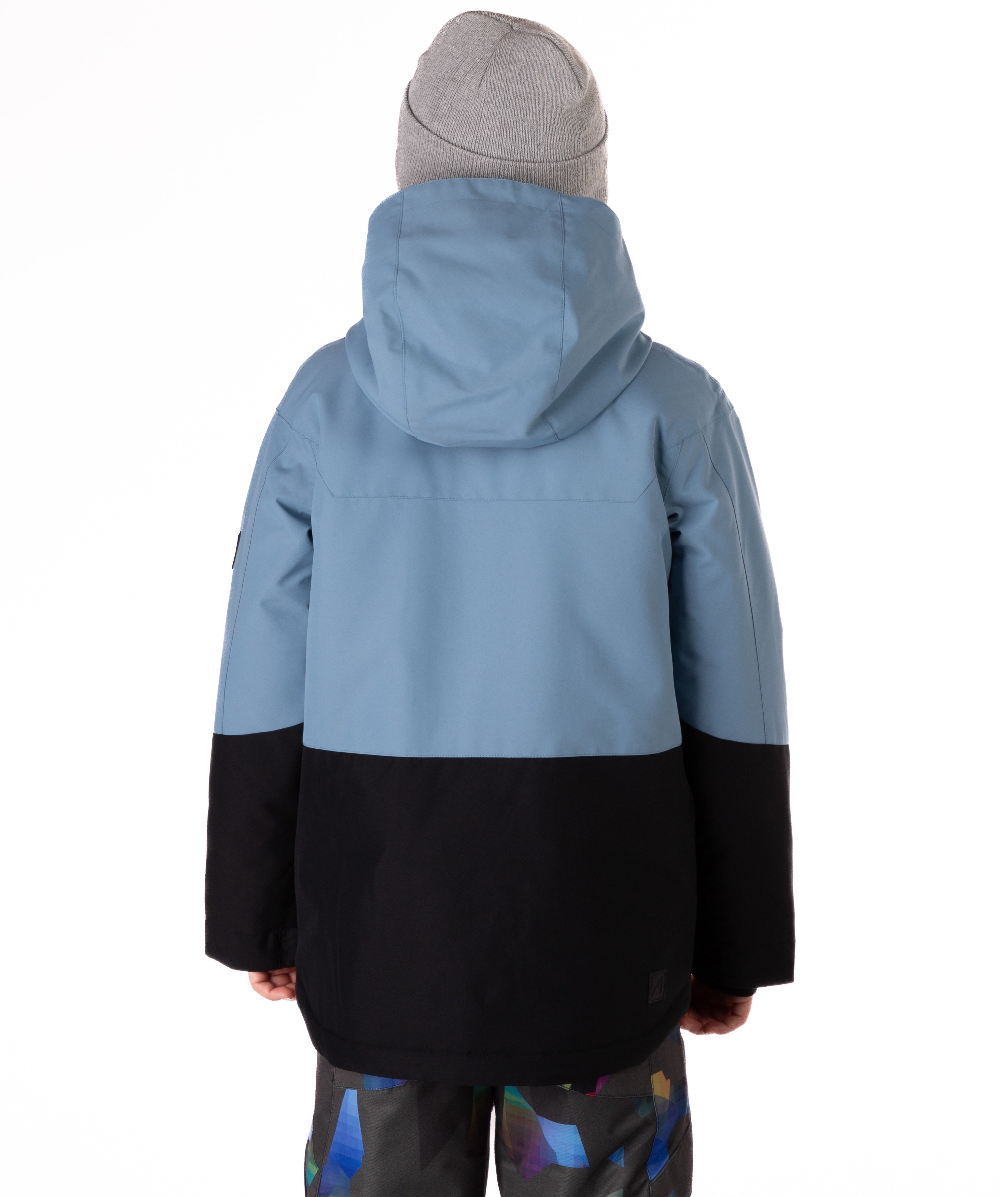 Youth Boy wearing a two-tone blue and black jacket on a white background