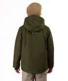 Youth boy wearing a olive green jacket with a brand logo on the back, standing against a white background