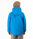 Youth Boy wearing a blue jacket with a visible brand logo on the back, standing against a white background.