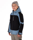 Child wearing a black and blue jacket with a hood on a white background