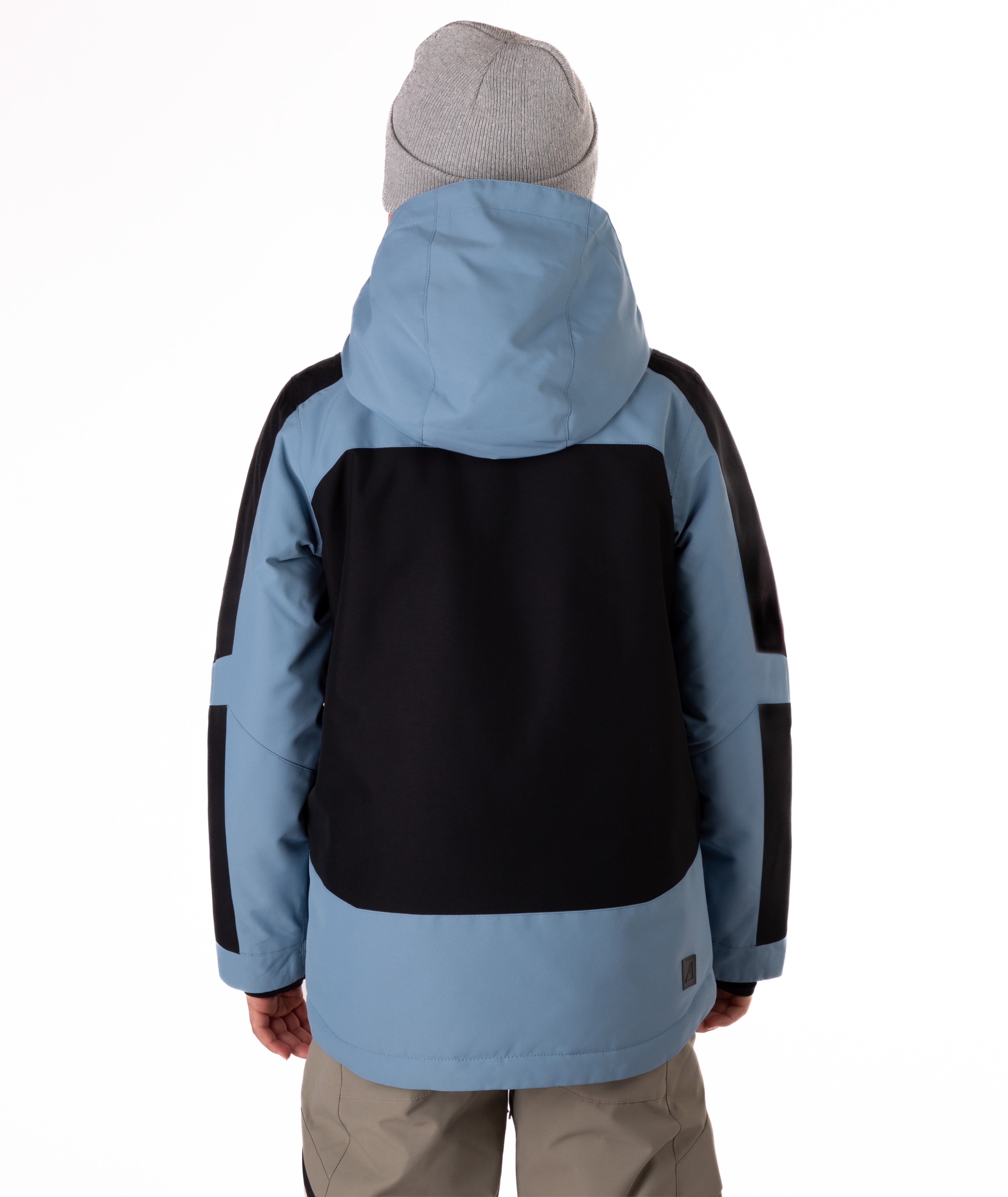 Back view of a child wearing a black and blue jacket on a white background