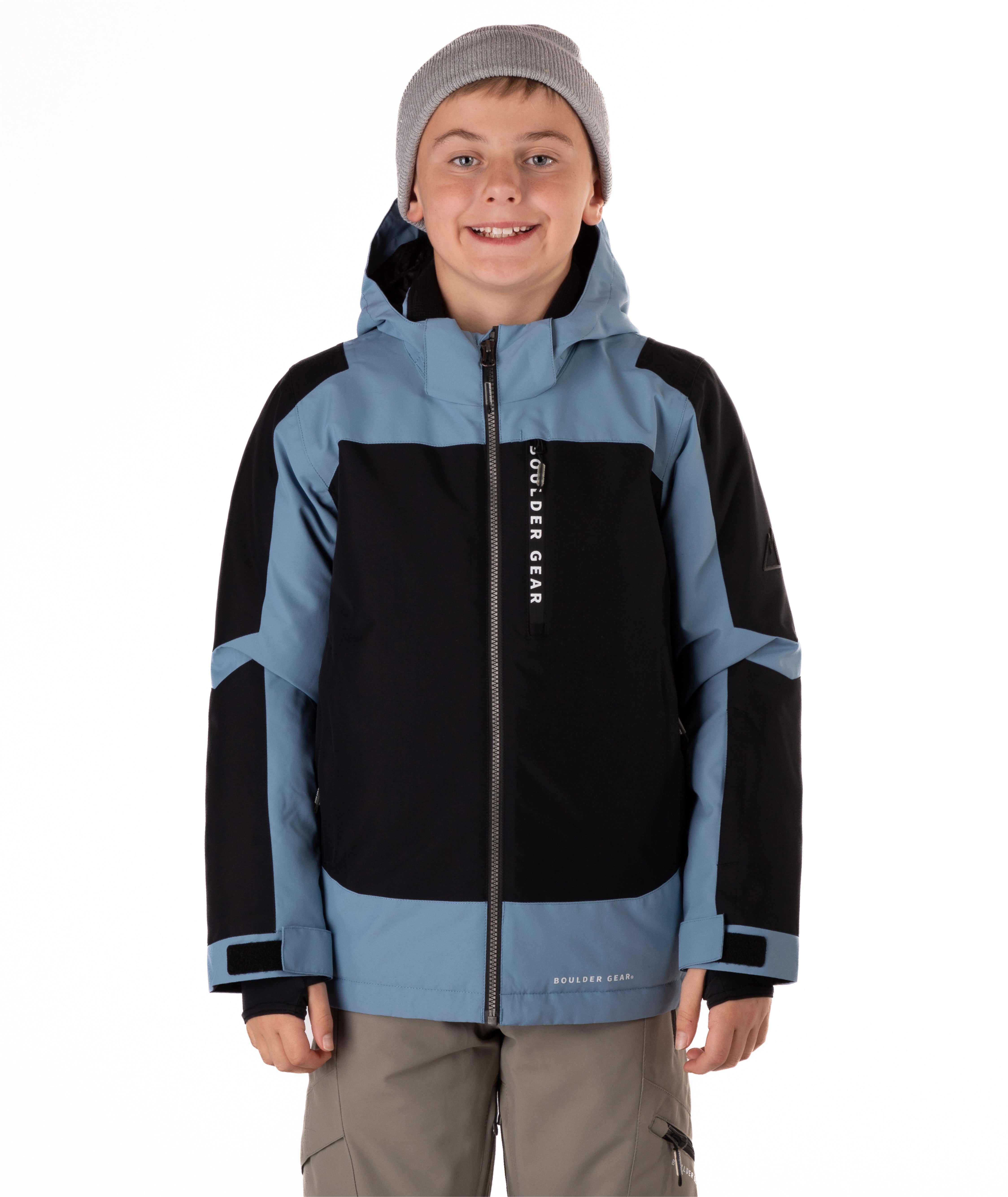 Child wearing a black and blue jacket with a visible Boulder Gear brand logo on a white background