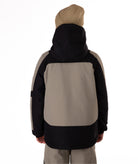 Back view of a child wearing a black and gray jacket on a white background