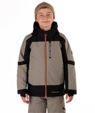 Child wearing a gray and black jacket with orange zipper on a white background