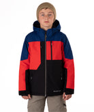 Boy wearing a colorful jacket with black, blue, and red sections on a white background