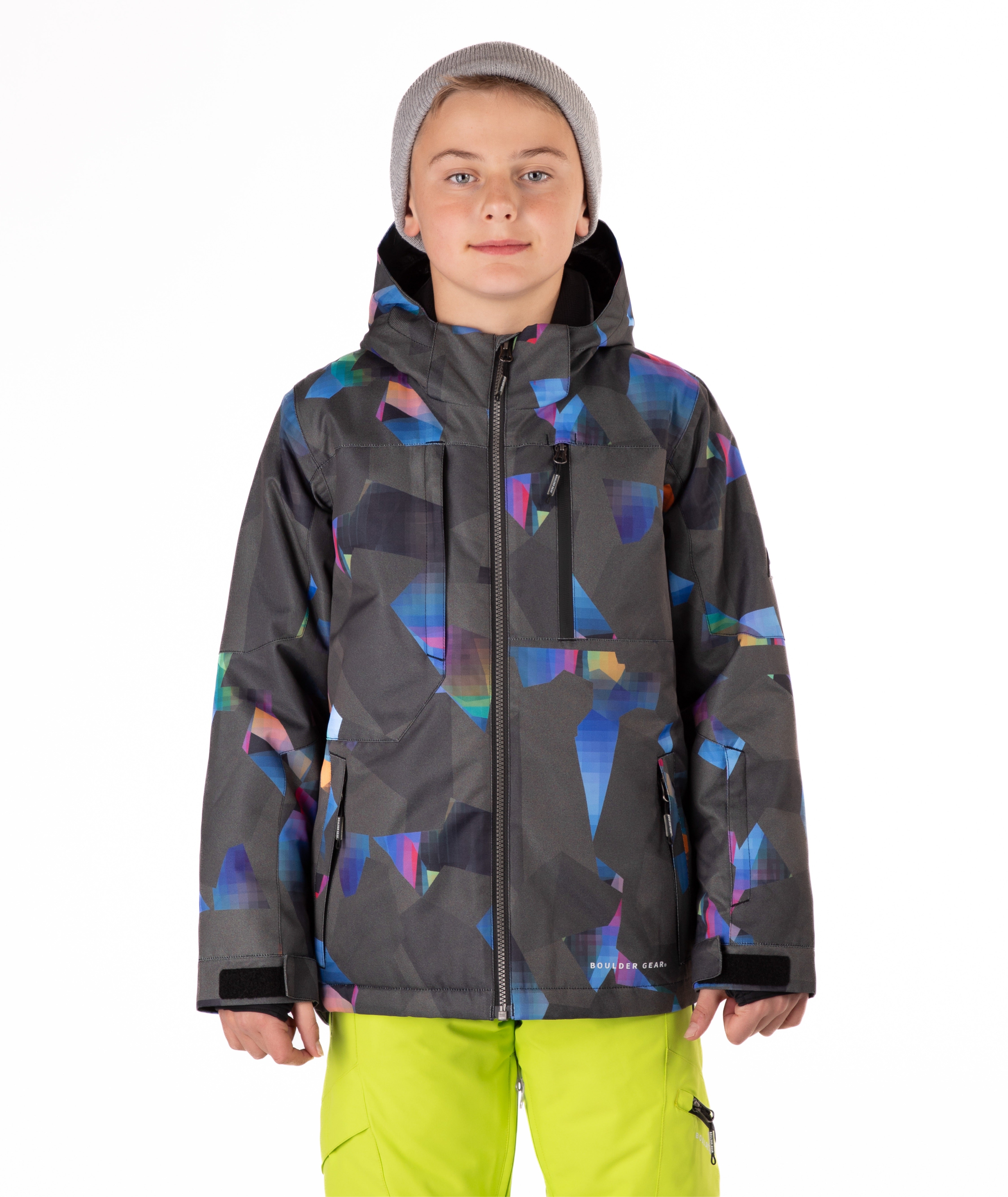 Youth boy wearing a colorful jacket with abstract patterns on a white background