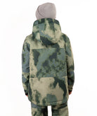 A child wearing a camouflage-patterned ski jacket and matching pants with a gray beanie, standing against a plain white background.