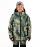 A child wearing a camouflage-patterned ski jacket and matching pants with a gray beanie, standing against a plain white background.