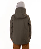 A child wearing a dark olive green hooded snowboard jacket, brown pants, and a gray beanie, standing against a plain white background.