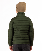 back of youth boy wearing a green puffer jacket on a white background