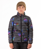 youth boy wearing a multi colored abstract patterned puffer jacket on a white background